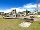 Outdoor playground with a slide and climbing area, plus a sandbox for playing horseshoes at 703 Hilchot Dr, Summerville, SC 29486