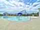 Resort-style pool area featuring a splash fountain, lounge chairs, and a picturesque community at 703 Hilchot Dr, Summerville, SC 29486