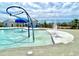 Zero entry pool with a splash fountain, lounge chairs, and well-manicured lawn at 703 Hilchot Dr, Summerville, SC 29486