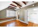 Charming attic bedroom showcasing exposed beams and built-in window bench seating at 76 Radcliffe St, Charleston, SC 29403