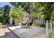 Private backyard featuring a cozy table with chairs and a beautifully built separate structure at 76 Radcliffe St, Charleston, SC 29403