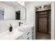 Modern bathroom with a large mirror, vanity, and a walk-in closet at 76 Radcliffe St, Charleston, SC 29403
