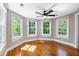Bright bedroom featuring hardwood floors, light grey walls, and plenty of sunlight at 76 Radcliffe St, Charleston, SC 29403