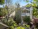 Charming two-story home with a welcoming porch and beautiful landscaped surroundings at 76 Radcliffe St, Charleston, SC 29403