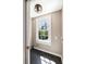 Bright laundry room with a large window and modern tile flooring at 76 Radcliffe St, Charleston, SC 29403