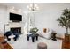 Sunlit living room boasts a fireplace, sleek decor, and a comfortable seating arrangement at 76 Radcliffe St, Charleston, SC 29403