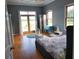Serene bedroom with water view access, hardwood floors, neutral walls, and modern furnishings at 7997 Doar Rd # C-3, Awendaw, SC 29429