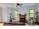 Inviting living room with a decorative fireplace, cozy seating, and bright natural light at 7997 Doar Rd # C-3, Awendaw, SC 29429