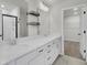 A bright bathroom features double sinks, a large mirror and black fixtures at 819 Casey St, Moncks Corner, SC 29461
