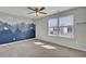 Bedroom with gray carpet, two windows and a wall design at 819 Casey St, Moncks Corner, SC 29461