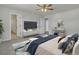 This bedroom has an ensuite bathroom, a ceiling fan, vanity and a view of the doorway at 819 Casey St, Moncks Corner, SC 29461