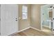 Inviting entryway featuring a bright window and a convenient powder room, plus a white front door at 819 Casey St, Moncks Corner, SC 29461