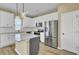 Modern kitchen boasts stainless steel appliances, white cabinets, and a functional island at 819 Casey St, Moncks Corner, SC 29461