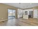Open kitchen with white cabinets, stainless steel appliances, and sliding glass door to backyard at 819 Casey St, Moncks Corner, SC 29461