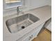 Close-up of the stainless steel kitchen sink, faucet, and countertop at 819 Casey St, Moncks Corner, SC 29461