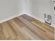 Bright laundry room with light wood-look floors and white baseboards at 819 Casey St, Moncks Corner, SC 29461
