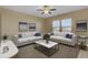 Bright living room featuring modern furniture, neutral tones, and large windows at 819 Casey St, Moncks Corner, SC 29461