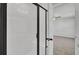 The walk-in shower features black trim and a large white tile backsplash at 819 Casey St, Moncks Corner, SC 29461