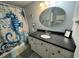 Charming bathroom with a seahorse shower curtain and neutral countertops at 855 Club Cottage Rd, Edisto Island, SC 29438