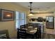 Bright dining area featuring white cabinets and modern appliances adjacent to the kitchen at 855 Club Cottage Rd, Edisto Island, SC 29438