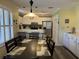 Eat-in kitchen boasts white cabinets, stainless steel appliances, and lots of storage at 855 Club Cottage Rd, Edisto Island, SC 29438