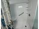Walk-in shower featuring a patterned shower curtain and grab bar at 855 Club Cottage Rd, Edisto Island, SC 29438