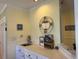 Conveniently located wet bar and storage area features a stainless steel sink and white cabinets at 855 Club Cottage Rd, Edisto Island, SC 29438