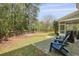 Enjoy outdoor living in this backyard with patio, seating and fire pit, perfect for relaxing or entertaining at 8566 Royal Palm Ln, North Charleston, SC 29420