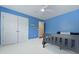 Bedroom boasts a ceiling fan, blue walls, and a large closet at 8566 Royal Palm Ln, North Charleston, SC 29420