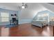 Bedroom features wood floors, a desk area, and great natural light at 8566 Royal Palm Ln, North Charleston, SC 29420