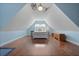 Spacious bedroom with hardwood floors, vaulted ceiling, and ample natural light at 8566 Royal Palm Ln, North Charleston, SC 29420