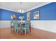 Dining area with hardwood floors, large window, and elegant decor is ready for Gathering gatherings at 8566 Royal Palm Ln, North Charleston, SC 29420