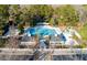 Aerial view showcasing the community pool, playground, clubhouse, and well-maintained grounds at 8642 W Fairway Woods Dr, North Charleston, SC 29420