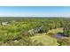 A view of a community with lush greenery and a beautiful golf course, creating an idyllic environment for upscale residential living at 8642 W Fairway Woods Dr, North Charleston, SC 29420