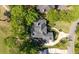 An aerial perspective displays a home nestled amongst lush greenery and manicured lawns, creating an inviting and peaceful setting at 8642 W Fairway Woods Dr, North Charleston, SC 29420
