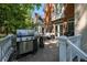 Back deck boasts a stainless steel grill and comfortable outdoor seating at 8642 W Fairway Woods Dr, North Charleston, SC 29420