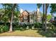 Expansive backyard featuring a patio, lush greenery, and mature trees for privacy at 8642 W Fairway Woods Dr, North Charleston, SC 29420
