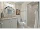 Well-lit bathroom with vanity, mirror, shower, and toilet at 8642 W Fairway Woods Dr, North Charleston, SC 29420