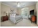 Comfortable bedroom featuring neutral walls, carpeted floors and access to a private balcony at 8642 W Fairway Woods Dr, North Charleston, SC 29420