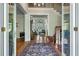 Grand foyer featuring hardwood floors, a staircase, and an open view to the living spaces at 8642 W Fairway Woods Dr, North Charleston, SC 29420