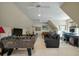 This bonus room features a foosball table, pool table, TV, and desk at 8642 W Fairway Woods Dr, North Charleston, SC 29420