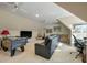 Large game room features a TV, pool table, foosball table, and lounge area at 8642 W Fairway Woods Dr, North Charleston, SC 29420