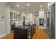 Well-appointed kitchen featuring stainless steel appliances, dark countertops, and ample cabinet space with a kitchen island centerpiece at 8642 W Fairway Woods Dr, North Charleston, SC 29420
