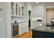 Bright kitchen featuring white cabinets, granite countertops, and stainless appliances is an inviting space for meal preparation at 8642 W Fairway Woods Dr, North Charleston, SC 29420