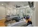 Comfortable living room with coffered ceilings, fireplace, hardwood floors, and ample natural light at 8642 W Fairway Woods Dr, North Charleston, SC 29420