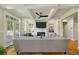 Spacious living room featuring a fireplace, coffered ceilings, hardwood floors, and backyard access at 8642 W Fairway Woods Dr, North Charleston, SC 29420