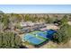 Aerial view of well-maintained tennis courts and parking area within the community at 8642 W Fairway Woods Dr, North Charleston, SC 29420