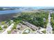 An aerial view of a townhouse community near the water and downtown, surrounded by lush greenery at 870 Colony Dr # A6, Charleston, SC 29407