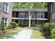 Charming townhouse exterior with well-kept landscaping, a walkway, and inviting entrances to the units at 870 Colony Dr # A6, Charleston, SC 29407