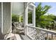 Inviting balcony offering a tranquil space with comfortable seating and beautiful views of the lush surroundings at 9 24Th Ave, Isle of Palms, SC 29451